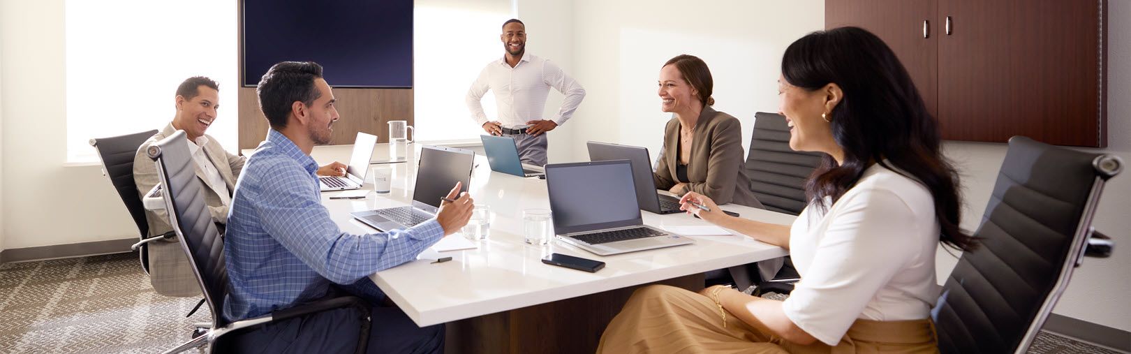 Staybridge Suites group meeting in a board room