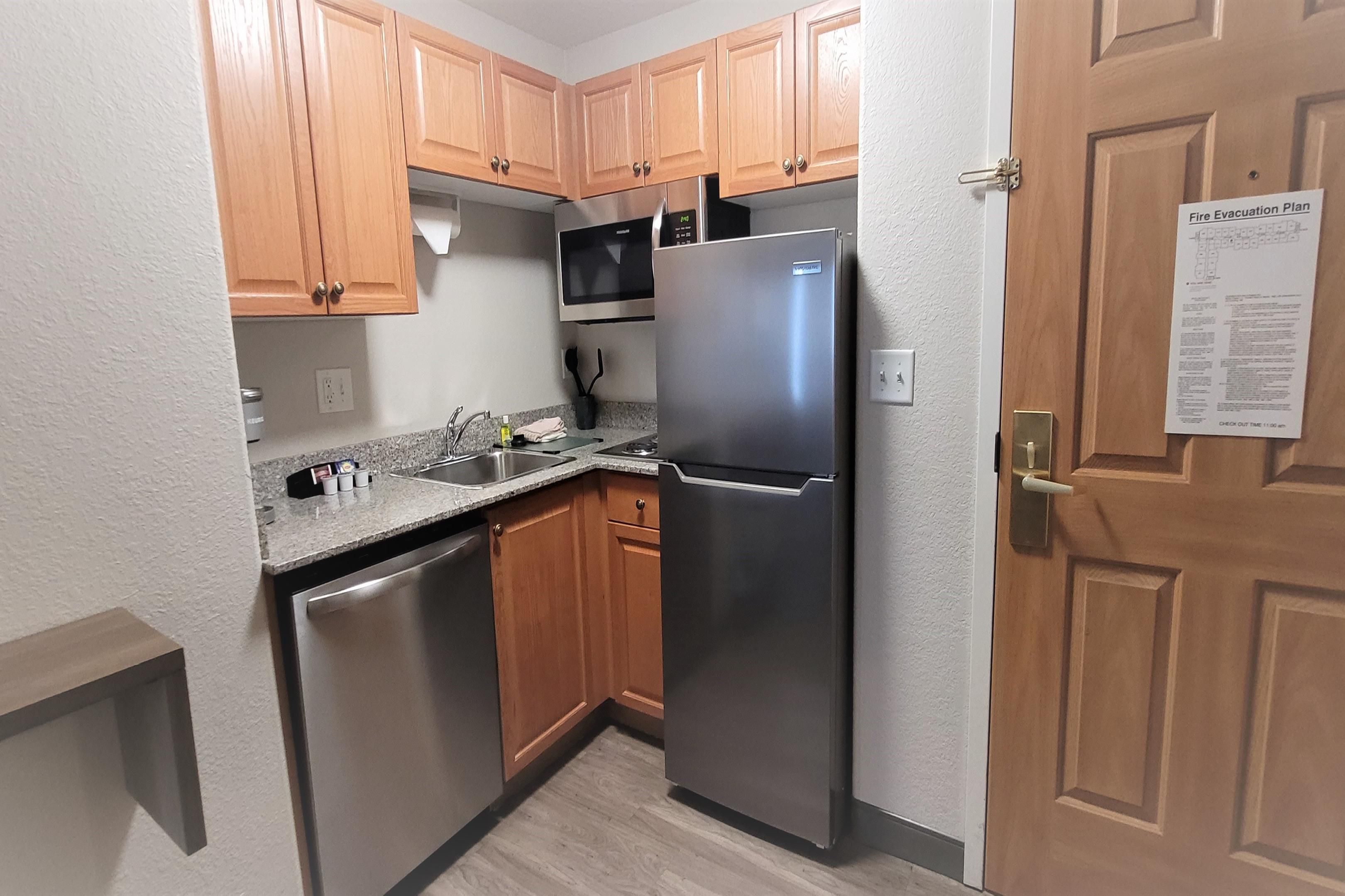 Our suites are designed with your comfort in mind, featuring fully equipped kitchens with a full-size fridge, microwave, dishwasher, stovetop, plates, and cutlery. Enjoy the convenience of our 24/7 complimentary laundry facilities. Make use of our outdoor grill and extra storage space. Plus, we're proud to be a pet-friendly hotel.