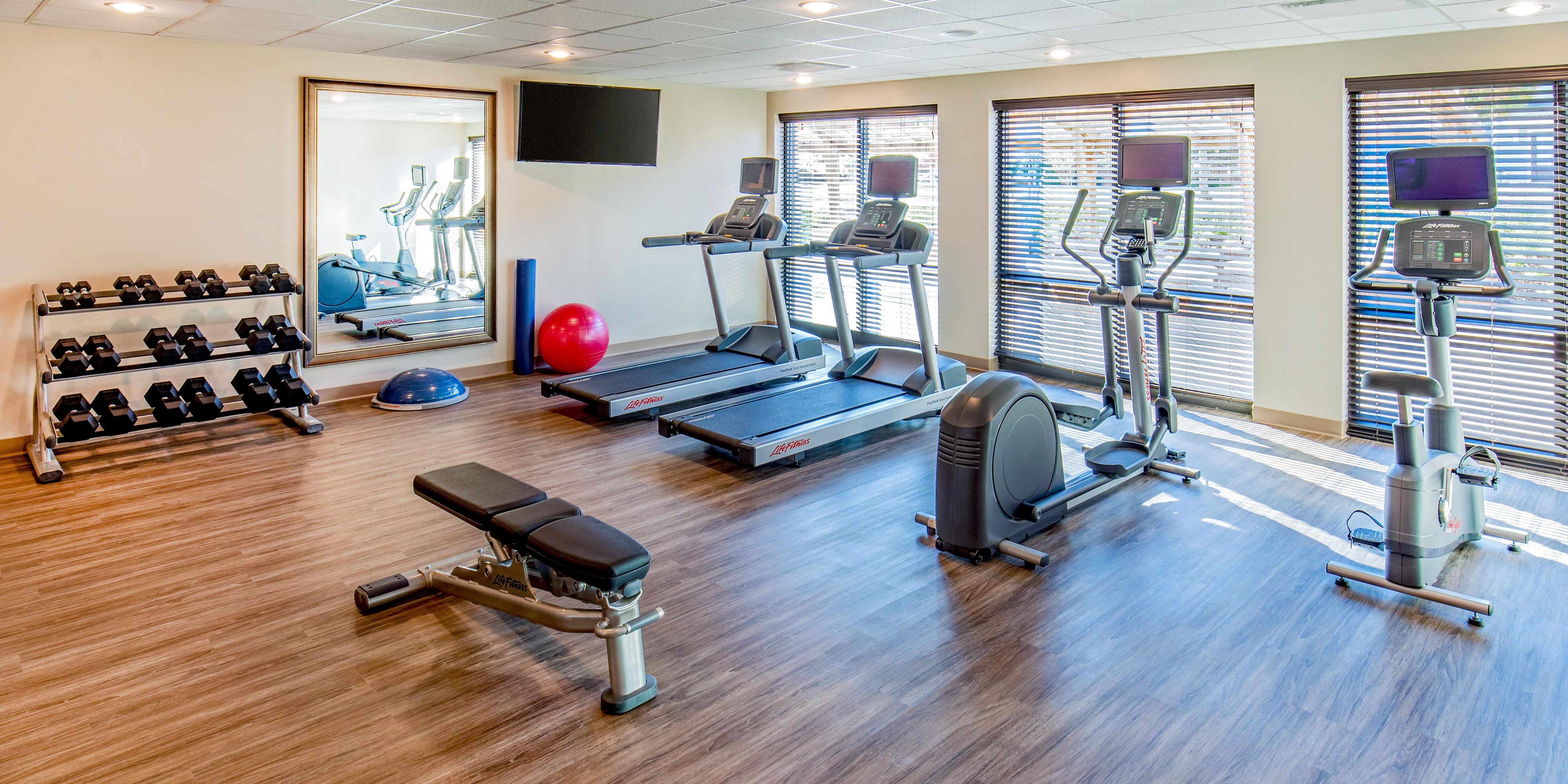 Embrace your workout in our 24/7 on-site fitness center & pool.