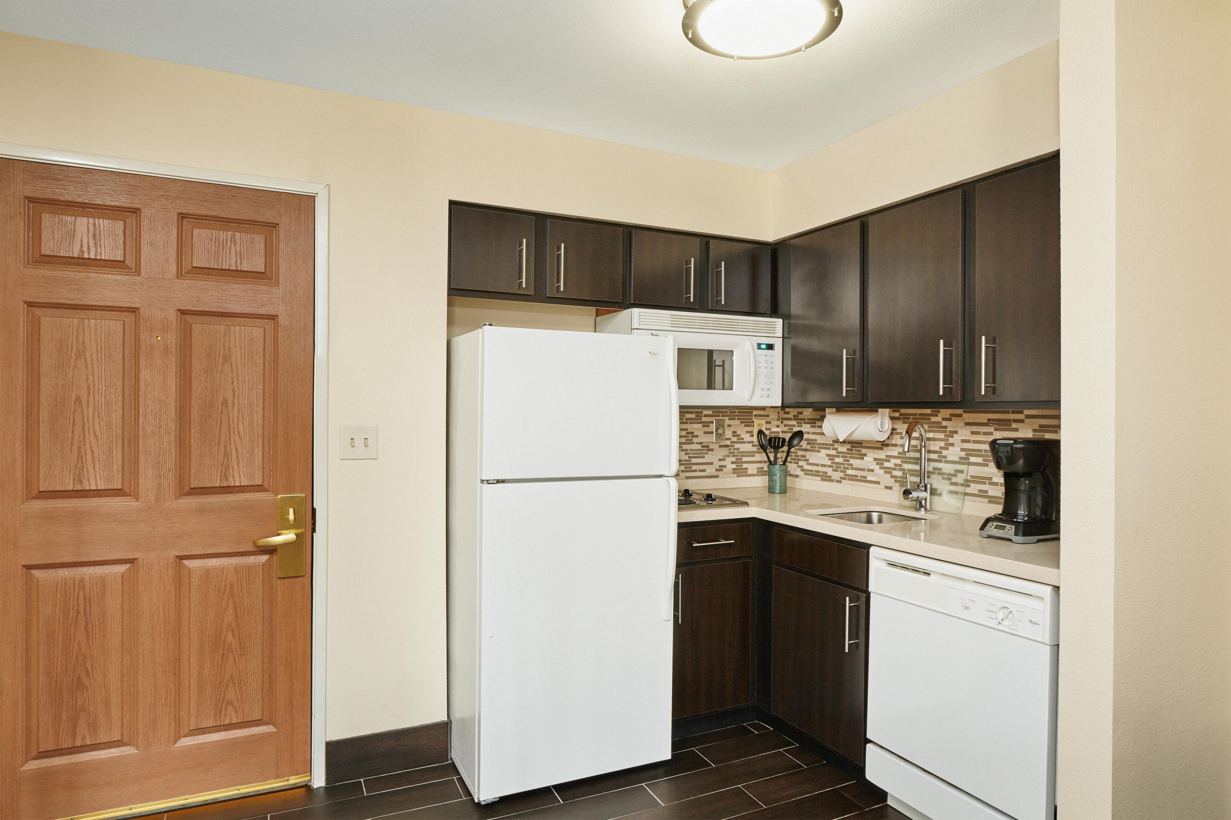 Experience the comfort of home in our spacious suites, each featuring a fully equipped kitchen with full-sized appliances. You'll find everything you need including plates, glasses, silverware, cooking utensils, a stovetop, dishwasher, microwave, coffee maker, toaster, and more. With our convenient setup, there's no need to overpack—just bring you.