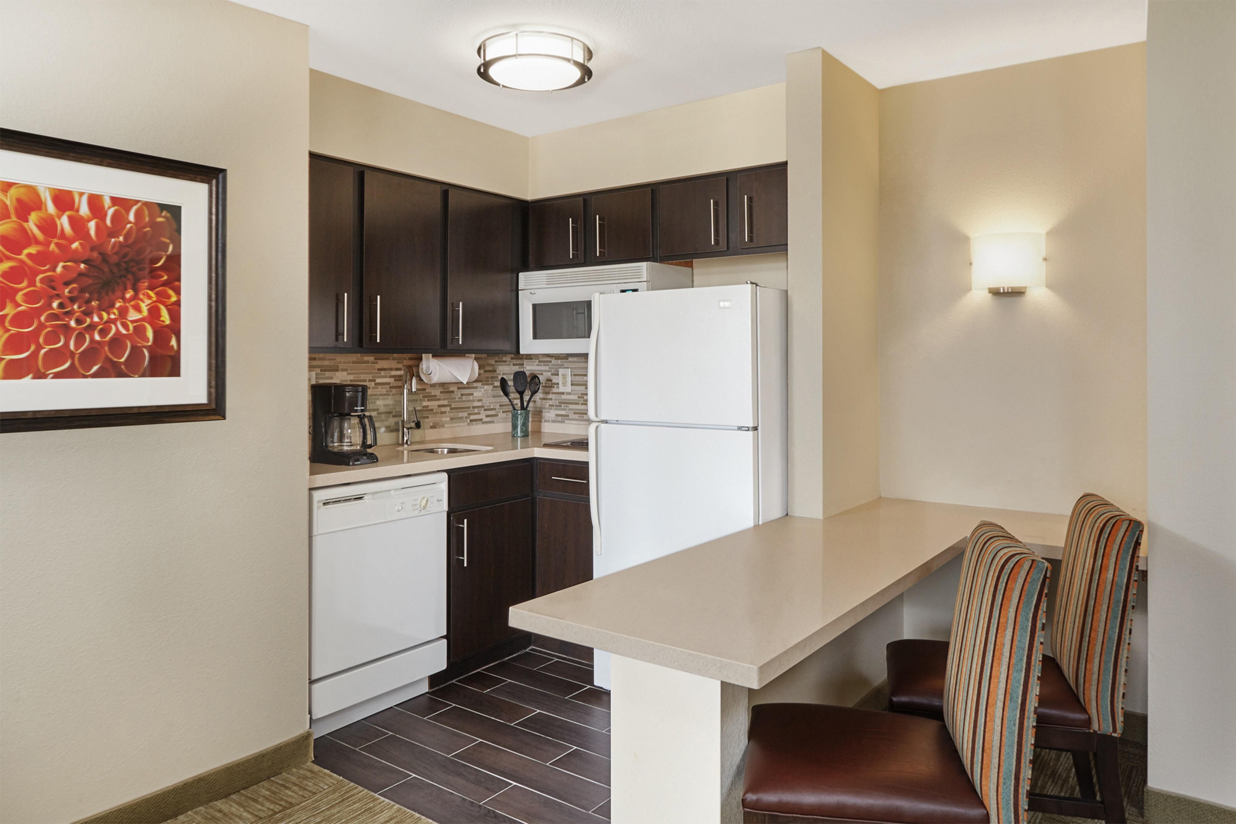 Experience the comfort of home in our spacious suites, each featuring a fully equipped kitchen with full-sized appliances. You'll find everything you need including plates, glasses, silverware, cooking utensils, a stovetop, dishwasher, microwave, coffee maker, toaster, and more. With our convenient setup, there's no need to overpack—just bring you.