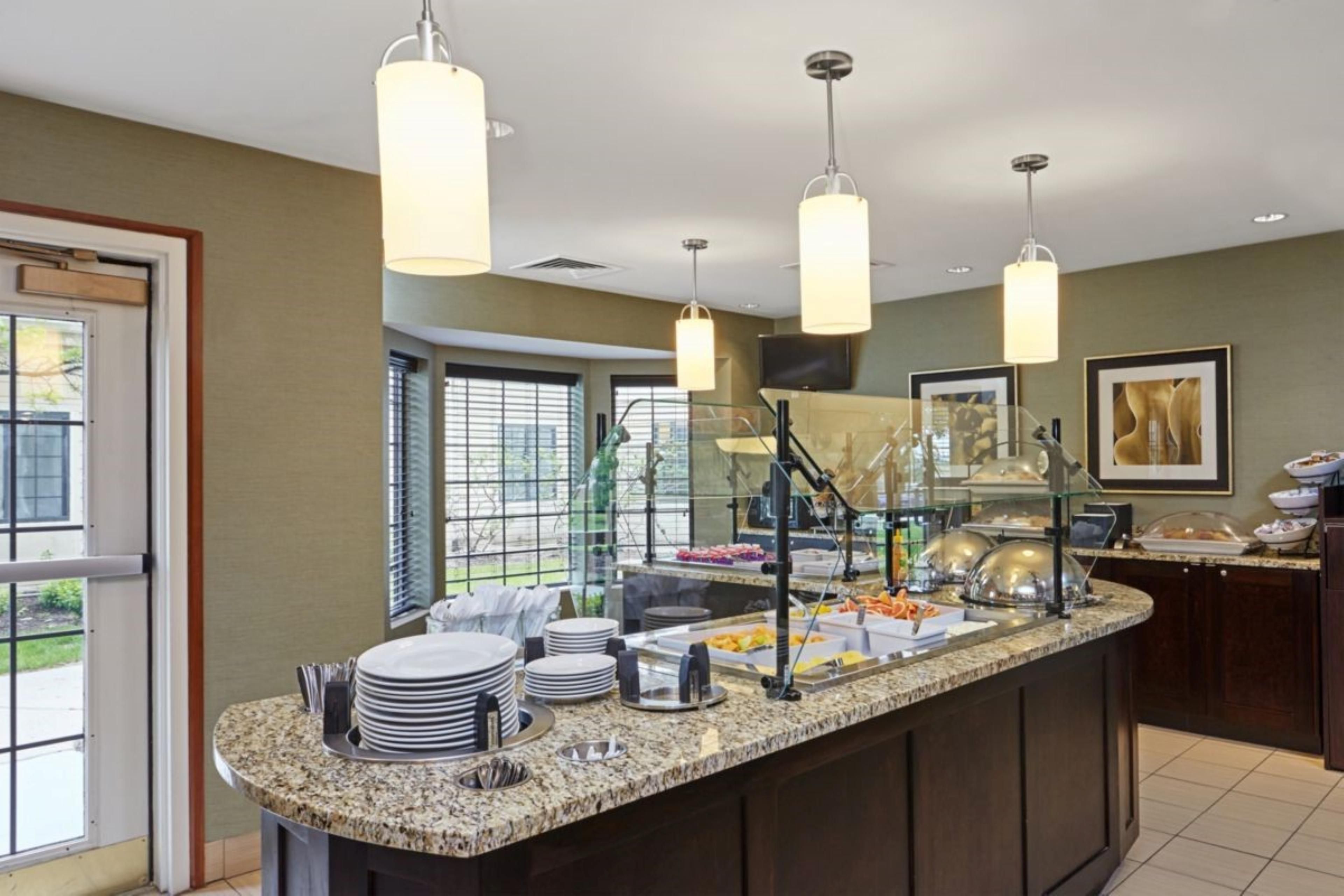 Indulge in a complimentary hot breakfast during your stay at Staybridge Suites! Each morning, savor a delightful array of options, including scrambled eggs, sausage or bacon, a yogurt parfait station, a make-your-own waffle station, cereals, fresh breads, delicious blueberry muffins, oatmeal, and much more. You'll find everything you need.