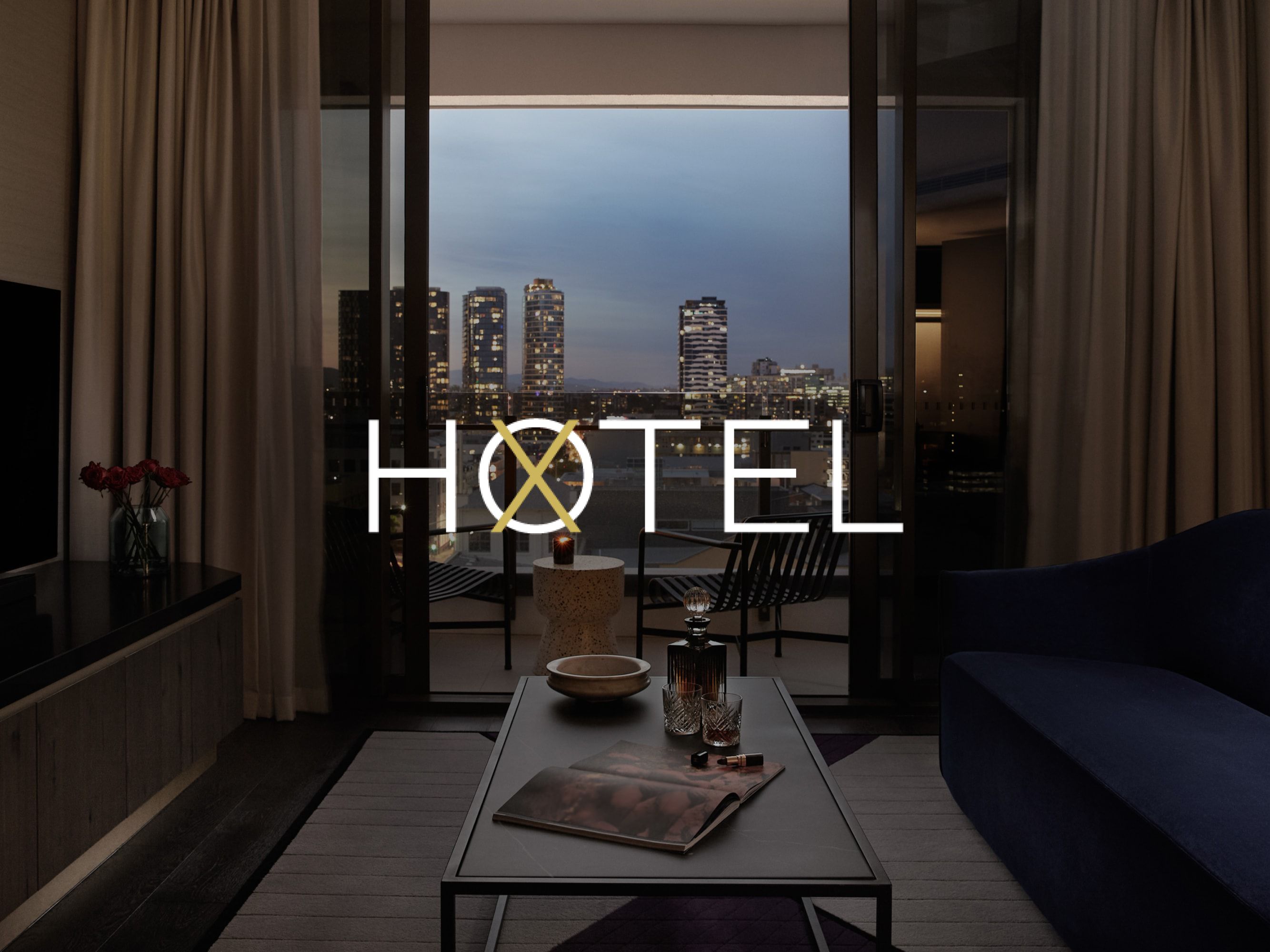 suite living room with dramatic views of city lights