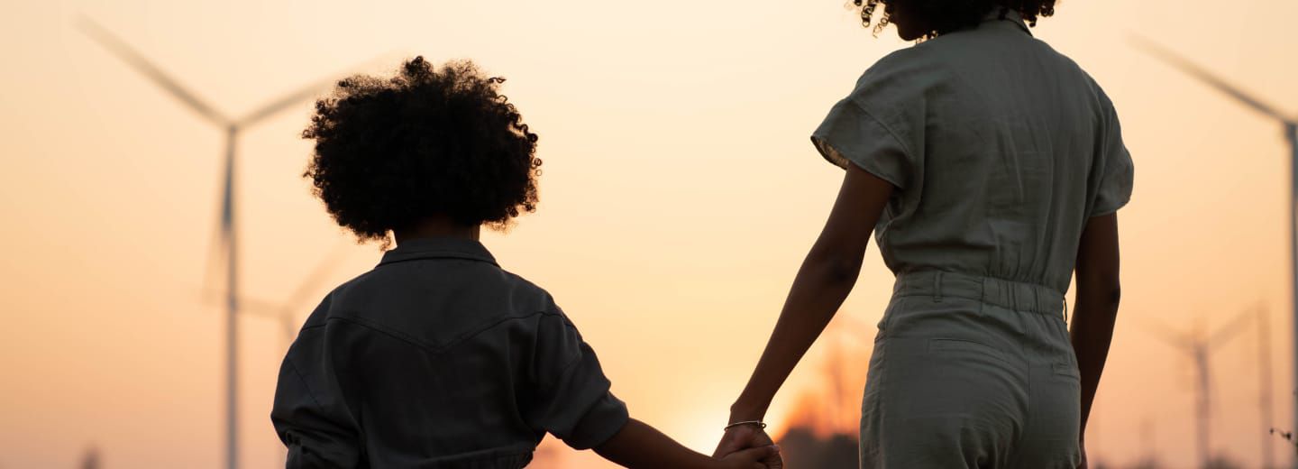 Parent and child walking hand in hand