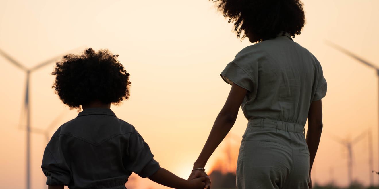 Parent and child walking hand in hand