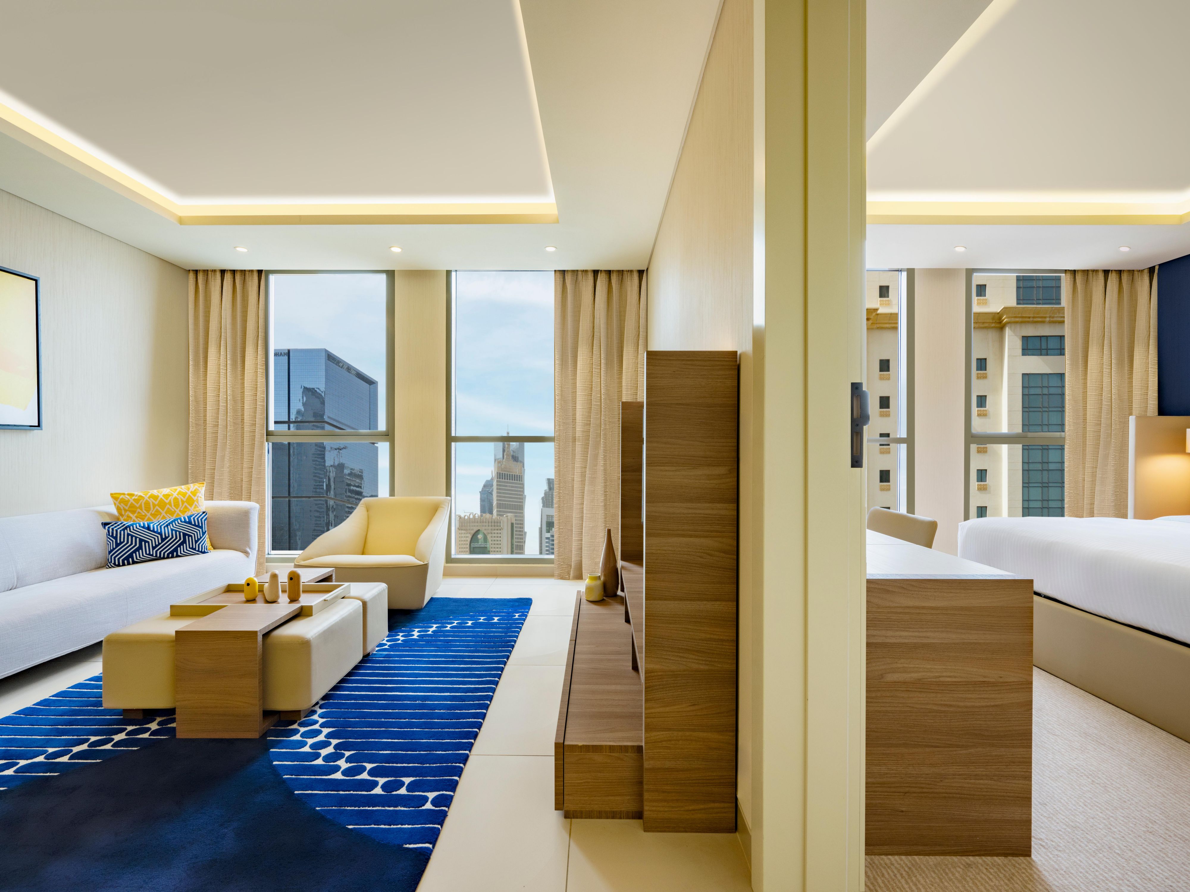 Experience the dynamic energy of West Bay while staying in our unstuffy suites in Doha, designed for both short and long stays. With charming interiors and the signature voco flair, our welcoming suites are your home away from home in the heart of Qatar’s capital city. Marvel at magnificent sunset views from the floor-to-ceiling windows.