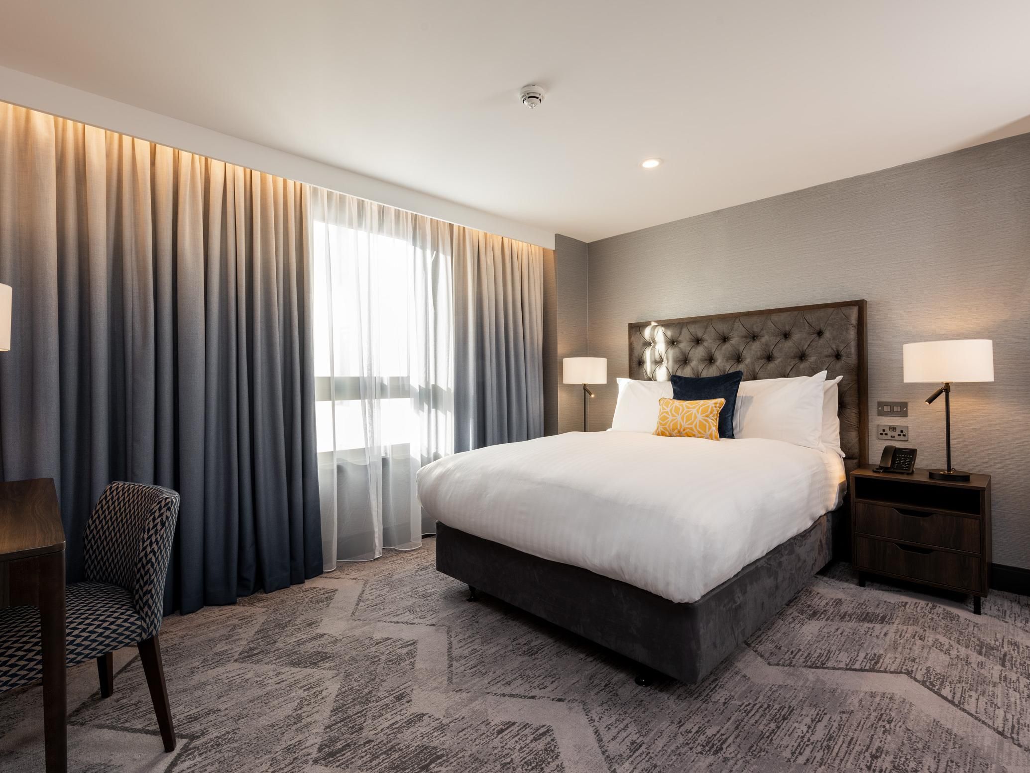 Accessible queen bedroom, interconnecting to another bedroom