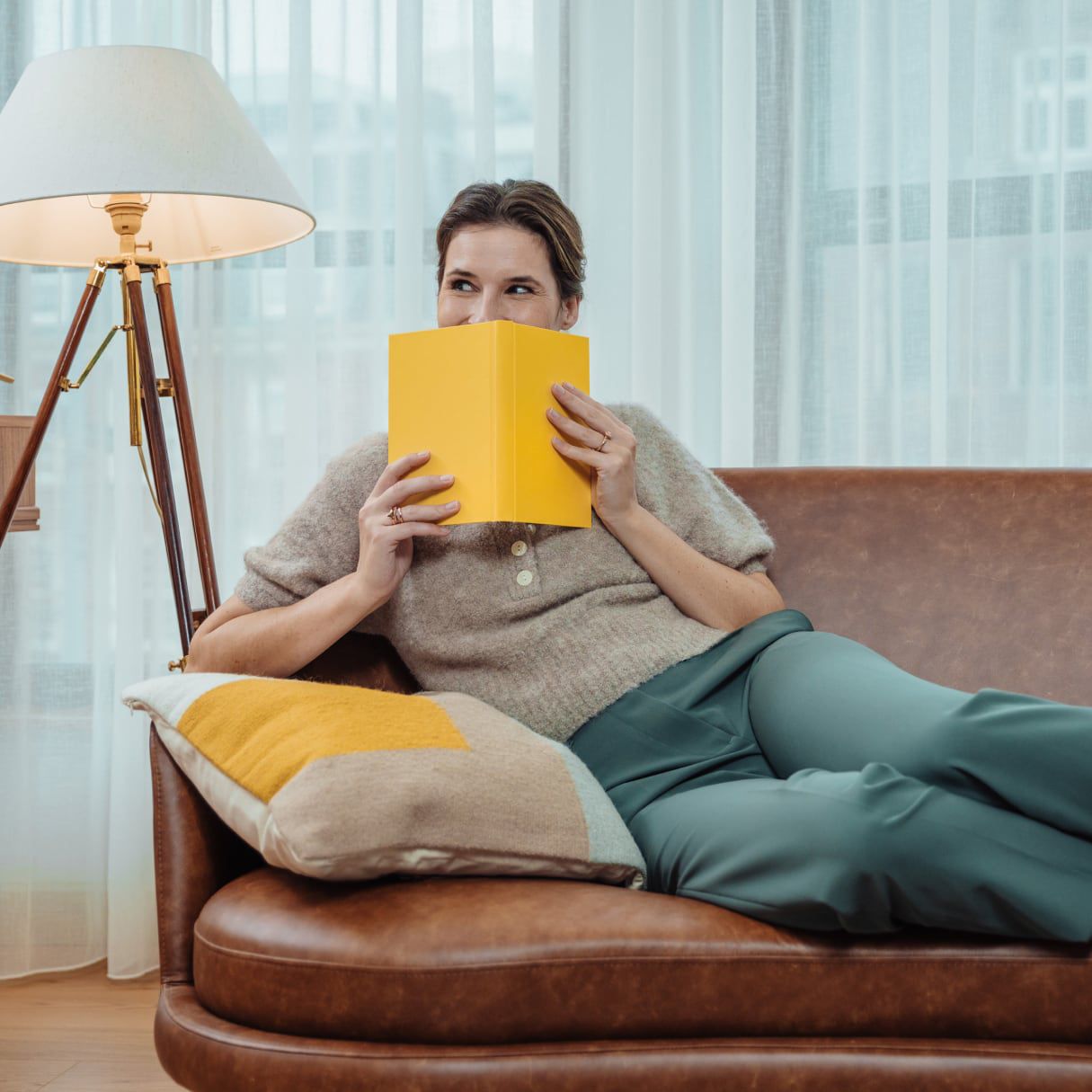 Guest enjoying a yellow book