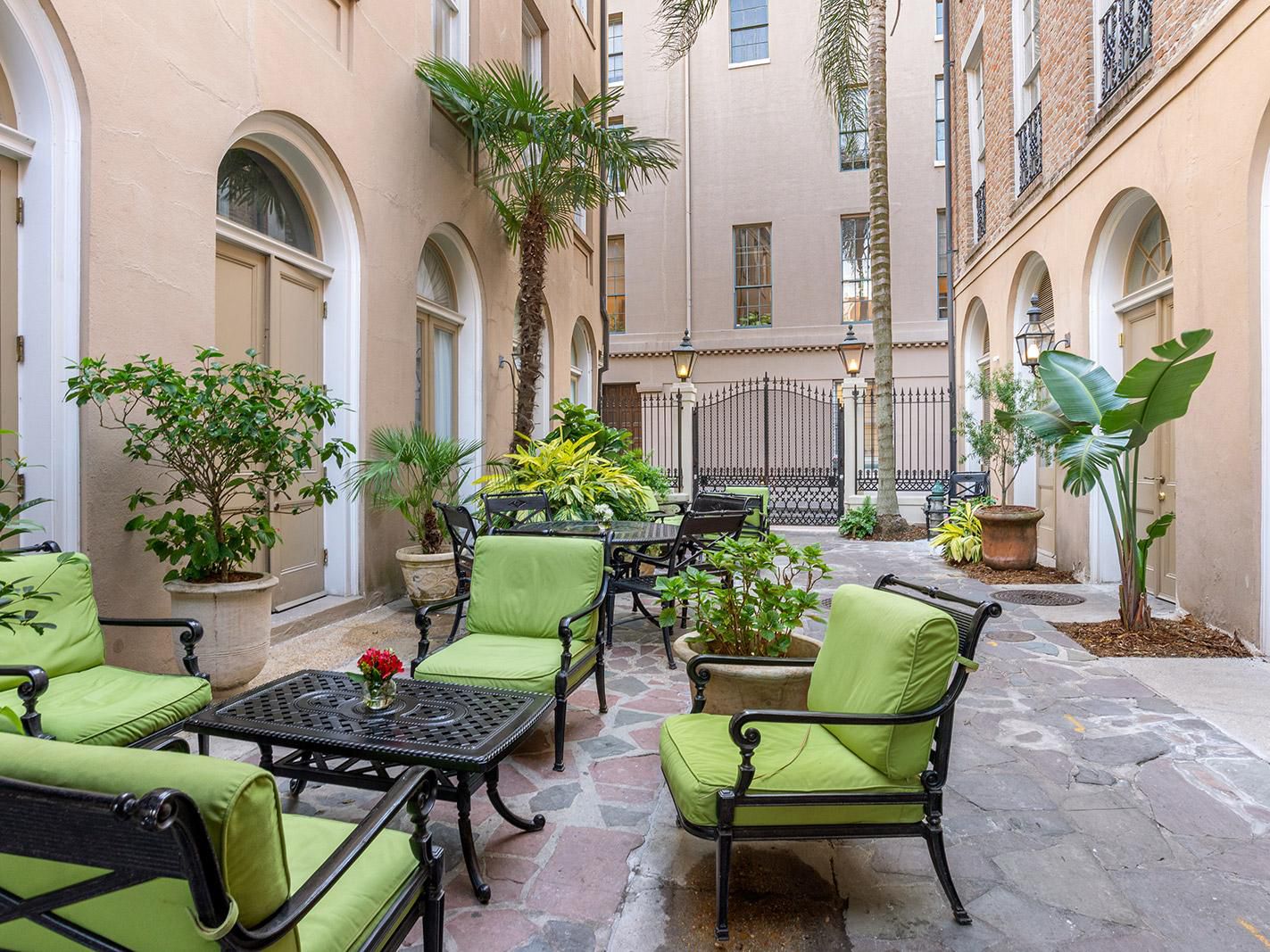 Retreat to our charming courtyard oasis, a tranquil escape from the lively streets of New Orleans. Gather with friends and family in one of our many inviting seating areas and enjoy a peaceful moment in the heart of the city. 