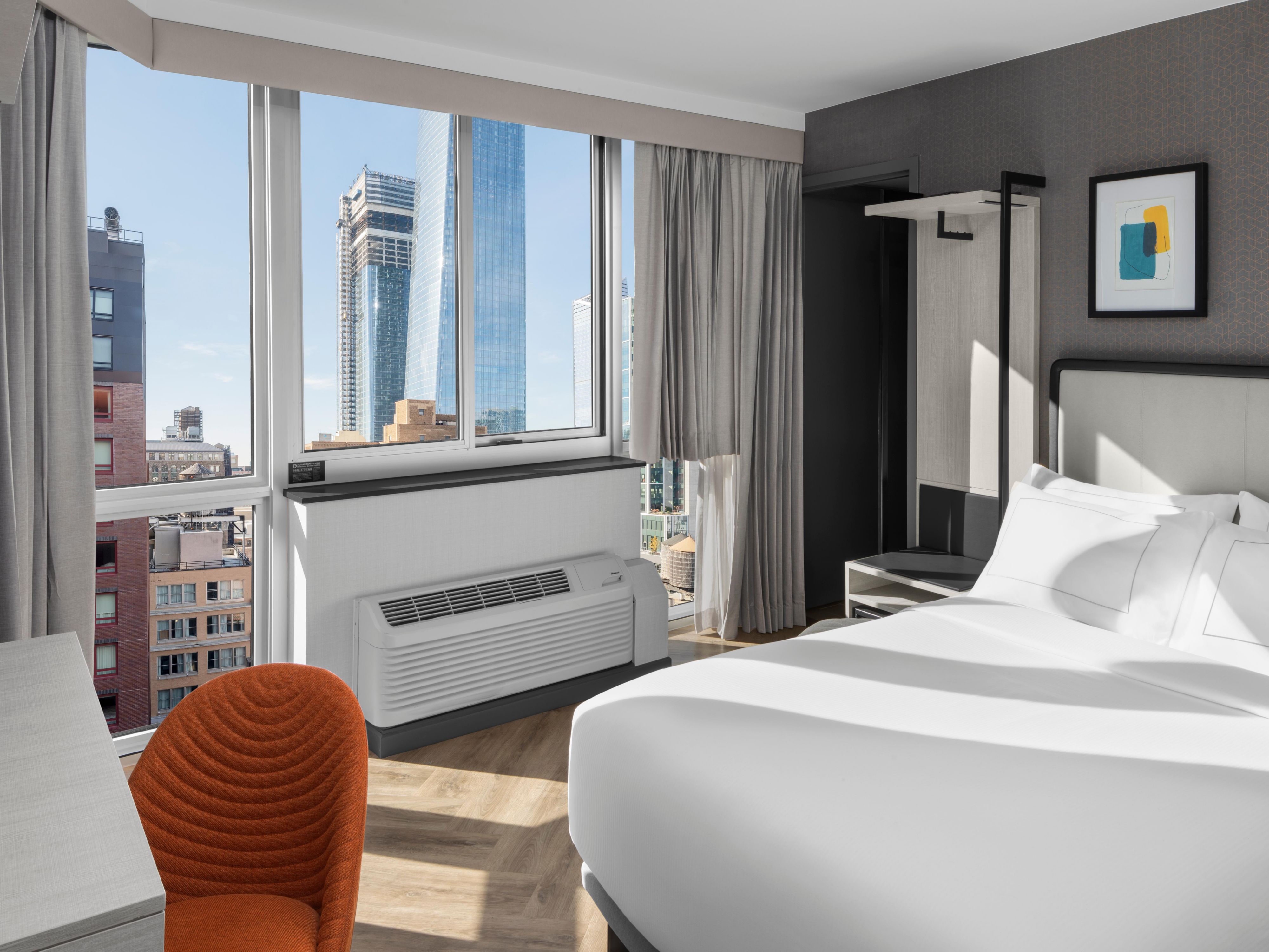 Unwind in style in our cozy West Midtown Manhattan rooms, featuring premium bedding, spa-inspired showers, and thoughtful touches like Keurig coffeemakers, strategically placed data ports, and free Wi-Fi. Designed for the perfect blend of functionality and relaxation, our rooms offer a serene retreat right in the heart of NYC.