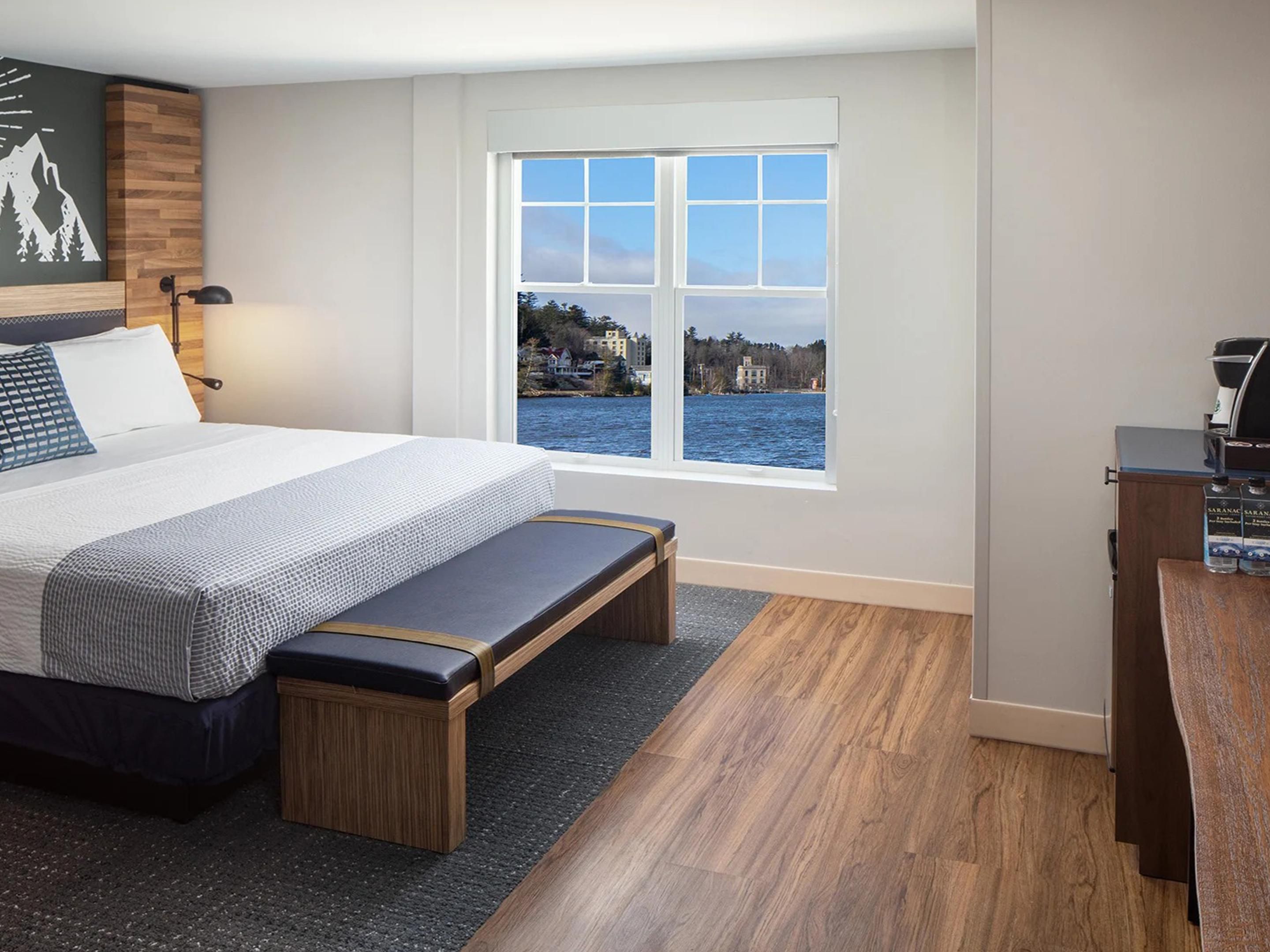 Wake up to breathtaking views of Flower Lake from your room. voco Saranac Lake NY - Waterfront offers serene lakeview accommodations that immerse you in Adirondack tranquility.