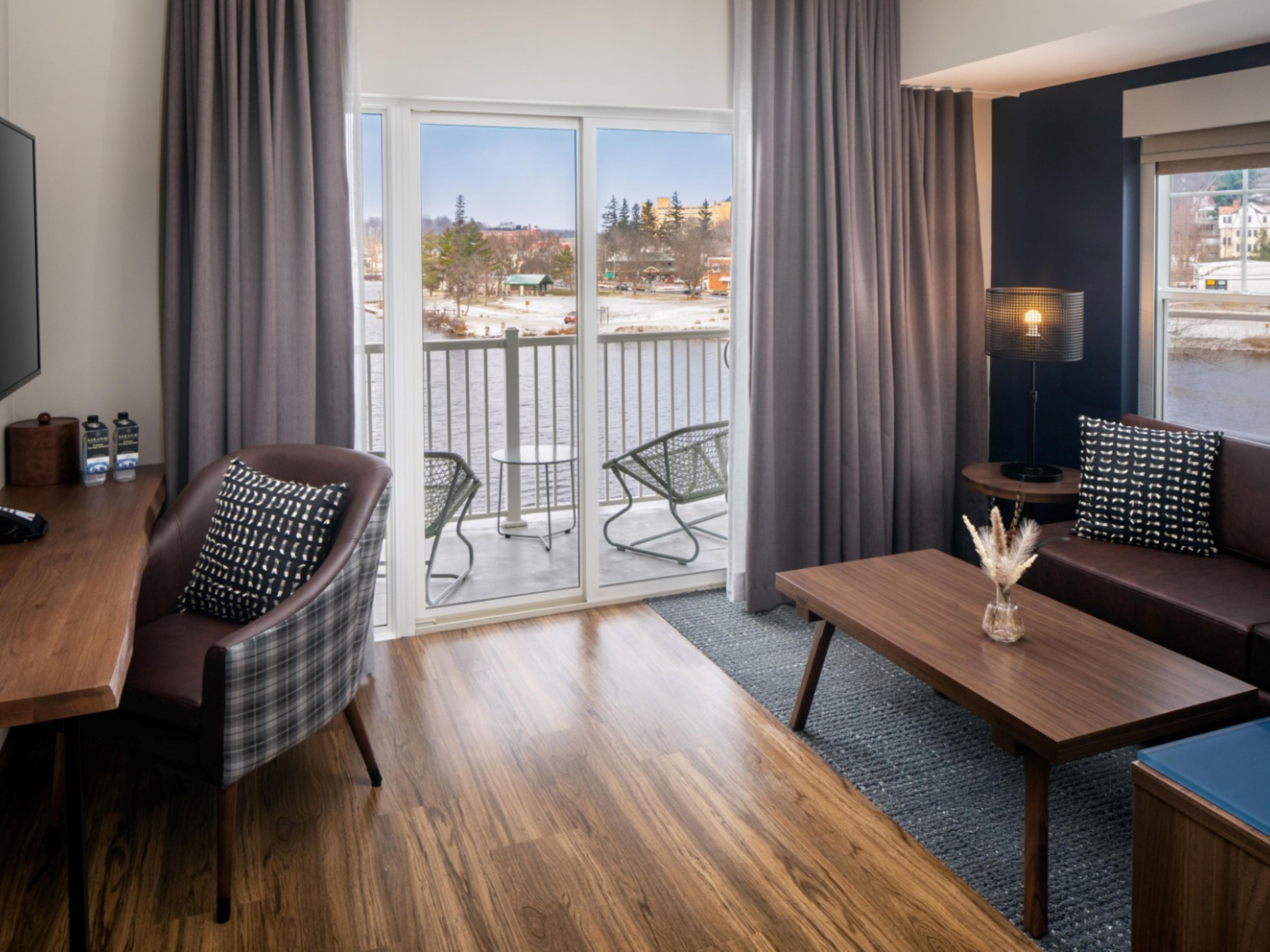 Upgrade your stay with spacious suites and premium rooms featuring modern comforts and Adirondack charm, ensuring a relaxing retreat at voco Saranac Lake NY - Waterfront.